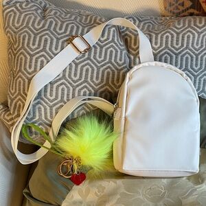 NWT Cross-body Sling bag Women's Bag with Poof & charm Keychain